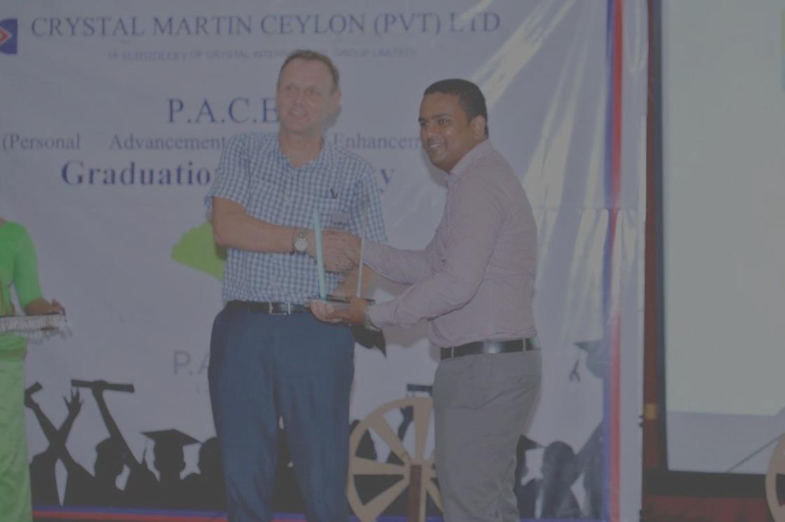 Colin Vose presenting at a PACE graduation ceremony