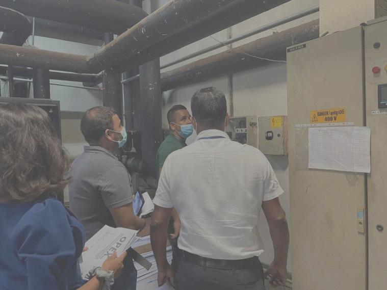 Audit team reviewing operational excellence standards on site