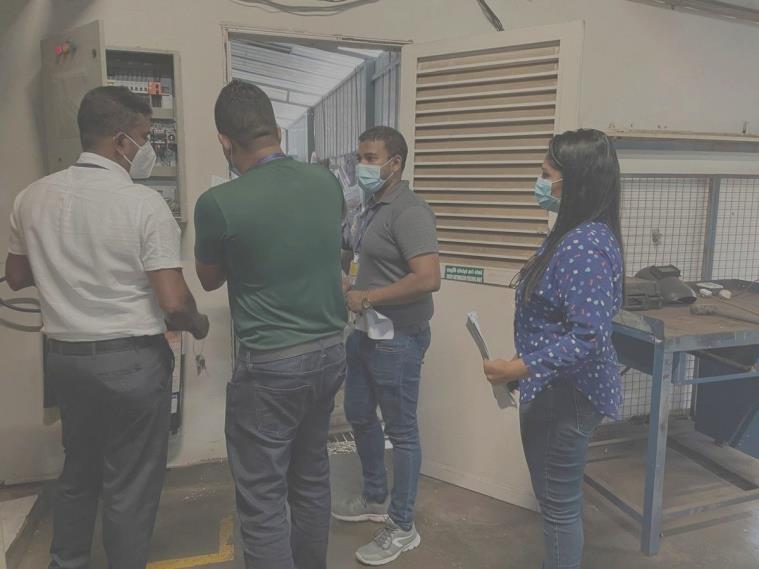 OPEX audit walkthrough on the factory floor, documentation in hand